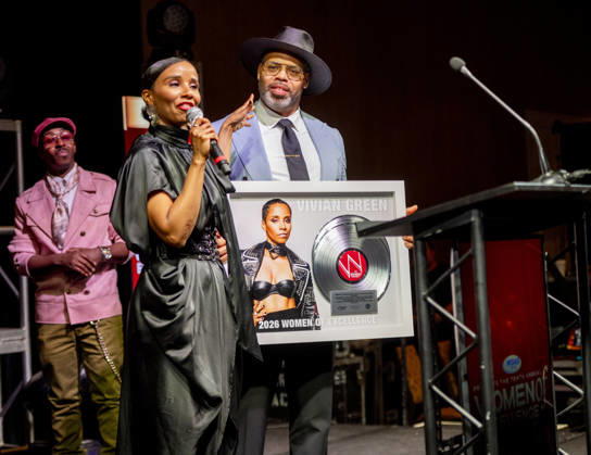 April 4, 2026, Philadelphia, Pennsylvania, United States: R&B singer, songwriter, VIVIAN GREEN, receives the Trailblazing award presented to her by ERIC ROBERSON, as rapper KWAME, looks on during the WDAS-FM tenth annual Women Of Excellence awards luncheon at the Philadelphia Sheraton Philadelphia United States - ZUMArf1_ 20260404_zaf_rf1_043 Copyright: xRickyxFitchettx