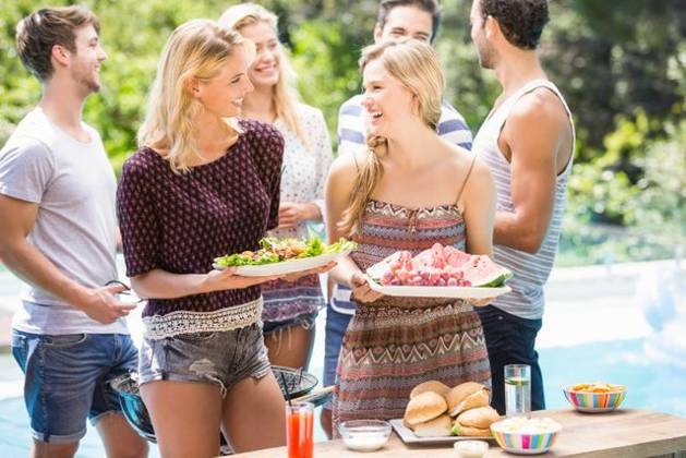 Friends preparing for outdoors barbecue party Friends preparing for outdoors barbecue party near pool, model released, , property released, Cape Town, South Africa, 03.11.2015, 690230.jpg, friend, friendship, casual clothing, swimming pool, poolside, sunny, summer, bright, resort, standing, smiling, cheerful, glass, juice, fruit juice, beverage, refreshment, grill, bbq, meal, cooking, meat, barbecue, lunch, tongs, preparing, attractive, beautiful, handsome, fashion, stylish, carefree, escapism, holiday, vacation, leisure, lifestyle, luxury, recreation, travel, happy, enjoyment, fun, together 20s, Young Adult, Man, Male, Caucasian, Woman, Female, 25-29 Years, Young Men, Caucasian Ethnicity, 20-24 Years, Young Women Outdoors,Focus on Foregro