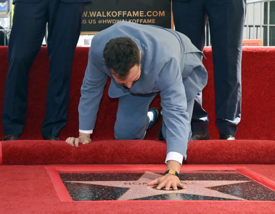 American actor, director and writer Noah Wyle touches his star during an unveiling ceremony honoring him with the 2,840th star on the Hollywood Walk of Fame in Los Angeles on Thursday, April 9, 2026. LAP20260409908 JIMxRUYMEN