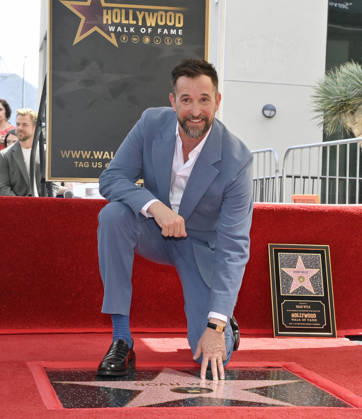 American actor, director and writer Noah Wyle touches his star during an unveiling ceremony honoring him with the 2,840th star on the Hollywood Walk of Fame in Los Angeles on Thursday, April 9, 2026.  LAP20260409911 JIMxRUYMEN