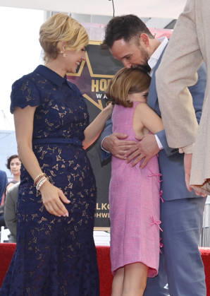American actor, director and writer Noah Wyle (blue suit) is joined by his wife, actress Sara Wells and daughter Frances Harper Wyle during an unveiling ceremony honoring him with the 2,840th star on the Hollywood Walk of Fame in Los Angeles on Thursday, April 9, 2026. LAP20260409914 JIMxRUYMEN