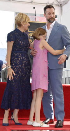 American actor, director and writer Noah Wyle (blue suit) is joined by his wife, actress Sara Wells and daughter Frances Harper Wyle during an unveiling ceremony honoring him with the 2,840th star on the Hollywood Walk of Fame in Los Angeles on Thursday, April 9, 2026. LAP20260409915 JIMxRUYMEN