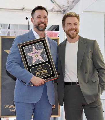 American actor, director and writer Noah Wyle is joined by dancer Derek Hough during an unveiling ceremony honoring him with the 2,840th star on the Hollywood Walk of Fame in Los Angeles on Thursday, April 9, 2026. LAP20260409916 JIMxRUYMEN