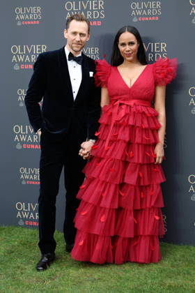 . 12 04 2026. London, United Kingdom. Tom Hiddlestone and partner arriving at The Olivier Awards in London.  xStephenxLockx xi-Imagesx IIM-26693-0032