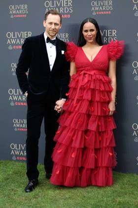 . 12 04 2026. London, United Kingdom. Tom Hiddlestone and partner arriving at The Olivier Awards in London.  xStephenxLockx xi-Imagesx IIM-26693-0033