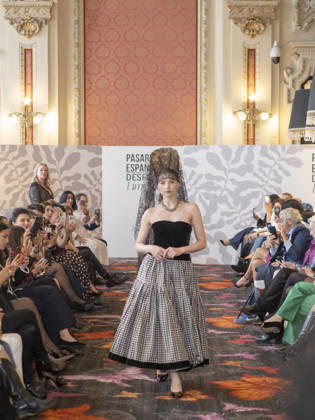 April 12, 2026, Madrid, Madrid, Spain: MADRID, SPAIN - APRIL 12: A model showcases a creation by TRADICIONES ISABELA during the Pasarela EspaoÂ±ola LimeLife at Casino Gran Via on April 12, 2026 in Madrid, Spain. Madrid Spain - ZUMAh199 20260412_zip_h199_013 Copyright: xAaronxHerediax