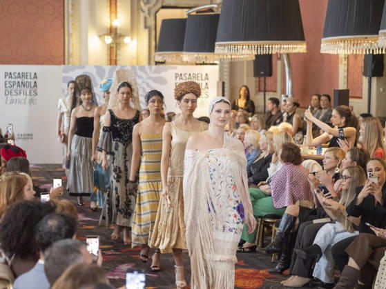 April 12, 2026, Madrid, Madrid, Spain: MADRID, SPAIN - APRIL 12: A model showcases a creation by TRADICIONES ISABELA during the Pasarela EspaoÂ±ola LimeLife at Casino Gran Via on April 12, 2026 in Madrid, Spain. Madrid Spain  - ZUMAh199 20260412_zip_h199_021 Copyright: xAaronxHerediax