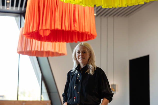 V&A East Museum at Queen Elizabeth Olympic Park, London, UK 14 April 2026 Artist Laura Wilson stands by her work Heads! Look to the Workers at V&A East Museum, Queen Elizabeth Olympic Park, London, UK, on 14 April 2026. Inscribed onto each of the sculptures is a poem honouring east London s makers. The sculptures are raised and lowered by teh V&A East team reflecting the working shifts patterns and tidal flow of the River Thames. The new museum opens to the public on 18 April 2026 as part of the East Bank development, celebrating making and creativity through its permanent Why We Make galleries, temporary exhibition The Music is Black: A British Story, and new creative commissions., Credit:Pete Speller Avalon Copyright: xPetexSpellerx xAvalonx 1090966600