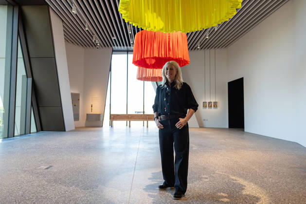 V&A East Museum at Queen Elizabeth Olympic Park, London, UK 14 April 2026 Artist Laura Wilson stands by her work Heads! Look to the Workers at V&A East Museum, Queen Elizabeth Olympic Park, London, UK, on 14 April 2026. Inscribed onto each of the sculptures is a poem honouring east London s makers. The sculptures are raised and lowered by teh V&A East team reflecting the working shifts patterns and tidal flow of the River Thames. The new museum opens to the public on 18 April 2026 as part of the East Bank development, celebrating making and creativity through its permanent Why We Make galleries, temporary exhibition The Music is Black: A British Story, and new creative commissions., Credit:Pete Speller Avalon Copyright: xPetexSpellerx xAvalonx 1090966617