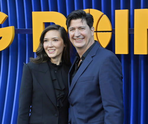 Cast member Ken Marino (R) and his wife Erica Oyama attend the premiere of Netflix s Season 2 TV series sport comedy Running Point at the Egyptian Theatre in the Hollywood section of Los Angeles on Wednesday, April 15, 2026. Storyline: Isla Gordon, overlooked her whole life, is appointed President of the LA Waves basketball team, a family business, when her brother enters rehab. She aims to prove she is the right choice despite skepticism.  LAP2026041555 JIMxRUYMEN