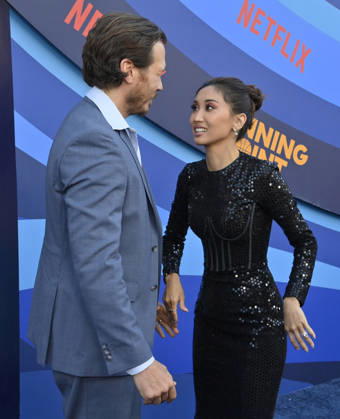 Cast members Scott MacArthur (L) and Brenda Song attend the premiere of Netflix s Season 2 TV series sport comedy Running Point at the Egyptian Theatre in the Hollywood section of Los Angeles on Wednesday, April 15, 2026. Storyline: Isla Gordon, overlooked her whole life, is appointed President of the LA Waves basketball team, a family business, when her brother enters rehab. She aims to prove she is the right choice despite skepticism.  LAP2026041531 JIMxRUYMEN