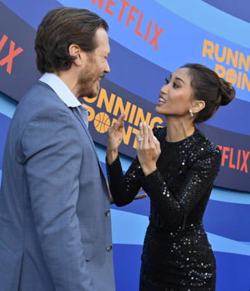 Cast members Scott MacArthur (L) and Brenda Song attend the premiere of Netflix s Season 2 TV series sport comedy Running Point at the Egyptian Theatre in the Hollywood section of Los Angeles on Wednesday, April 15, 2026. Storyline: Isla Gordon, overlooked her whole life, is appointed President of the LA Waves basketball team, a family business, when her brother enters rehab. She aims to prove she is the right choice despite skepticism.  LAP2026041534 JIMxRUYMEN