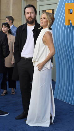 Cast member Kate Hudson and musician Danny Fujikawa attend the premiere of Netflix s Season 2 TV series sport comedy Running Point at the Egyptian Theatre in the Hollywood section of Los Angeles on Wednesday, April 15, 2026. Storyline: Isla Gordon, overlooked her whole life, is appointed President of the LA Waves basketball team, a family business, when her brother enters rehab. She aims to prove she is the right choice despite skepticism.  LAP2026041502 JIMxRUYMEN