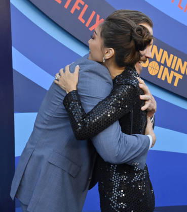 Cast members Scott MacArthur (L) and Brenda Song attend the premiere of Netflix s Season 2 TV series sport comedy Running Point at the Egyptian Theatre in the Hollywood section of Los Angeles on Wednesday, April 15, 2026. Storyline: Isla Gordon, overlooked her whole life, is appointed President of the LA Waves basketball team, a family business, when her brother enters rehab. She aims to prove she is the right choice despite skepticism.  LAP2026041533 JIMxRUYMEN