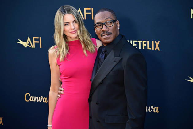 Eddie Murphy and wife Paige Butcher attend the 51st American Film Institute (AFI) Life Achievement Award ceremony at The Dolby Theatre in the Hollywood section of Los Angeles on Saturday, April 18, 2026. Hollywood legends gathered Saturday at the gala tribute to Eddie Murphy in celebration of his five-decade career.  LAP2026041847 JOHNxMCCOY