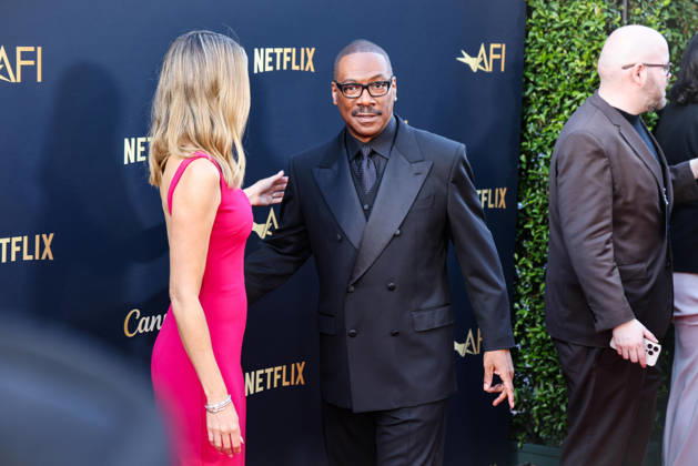April 18, 2026, Hollywood, California, USA: American Actor and Comedian EDDIE MURPHY, 65, and his Australian Actress wife PAIGE BUTCHER, 46, in a Barbie-pink dress, is on the Red Carpet before Murphy receives the American Film Instituteâ€⠢s (AFI) Life Time Achievement Award on April 18, 2026 in Hollywood, California at the Dolby Theater, Los Angeles. The event is sponsored by Netflix. Hollywood USA - ZUMAk144 20260418_znp_k144_004 Copyright: xAmyxKatzx