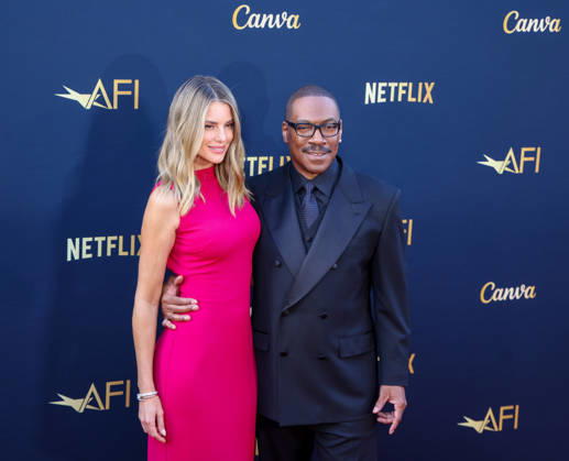 April 18, 2026, Hollywood, California, USA: American Actor and Comedian EDDIE MURPHY, 65, and his Australian Actress wife PAIGE BUTCHER, 46, in a Barbie-pink dress, is on the Red Carpet before Murphy receives the American Film Instituteâ€⠢s (AFI) Life Time Achievement Award on April 18, 2026 in Hollywood, California at the Dolby Theater, Los Angeles. The event is sponsored by Netflix. Hollywood USA - ZUMAk144 20260418_znp_k144_010 Copyright: xAmyxKatzx
