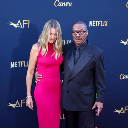 April 18, 2026, Hollywood, California, USA: American Actor and Comedian EDDIE MURPHY, 65, and his Australian Actress wife PAIGE BUTCHER, 46, in a Barbie-pink dress, is on the Red Carpet before Murphy receives the American Film Instituteâ€⠢s (AFI) Life Time Achievement Award on April 18, 2026 in Hollywood, California at the Dolby Theater, Los Angeles. The event is sponsored by Netflix. Hollywood USA - ZUMAk144 20260418_znp_k144_016 Copyright: xAmyxKatzx