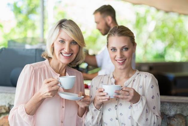 Portrait of smiling friends enjoying coffee together Portrait of smiling friends enjoying coffee together at restaurant, model released, , property released, Cape Town, South Africa, 21.11.2016, 928474.jpg, restaurant, coffee shop, hotel, food and drink industry, retail, business, customer, casual clothing, standing, holding, smiling, cheerful, happy, coffee, coffee cup, saucer, drink, beverage, refreshment, friend, friendship, enjoyment, joy, fun, confident, confidence, together, bonding, beautiful, attractive, pretty, leisure, lifestyle