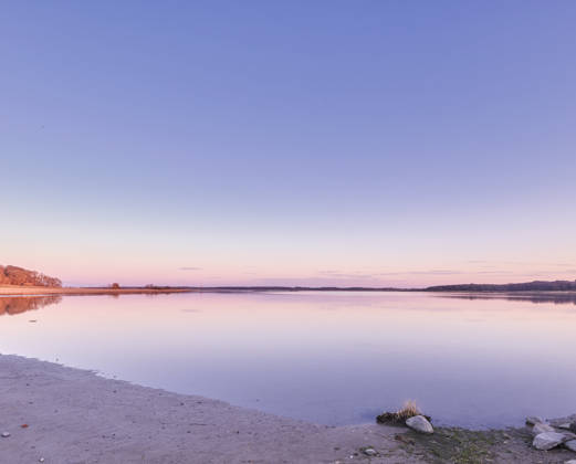 Beautiful landscape banner view of the ocean on the coast against a pink sunset in the sky in summer. Relaxing copyspace view of the calm sea water and beach at the seashore along the coastline. (License=RF) ,model released, Symbolfoto  Copyright: xZoonar.com KasperxRavlox 18892899 ,model released, Symbolfoto ,property released