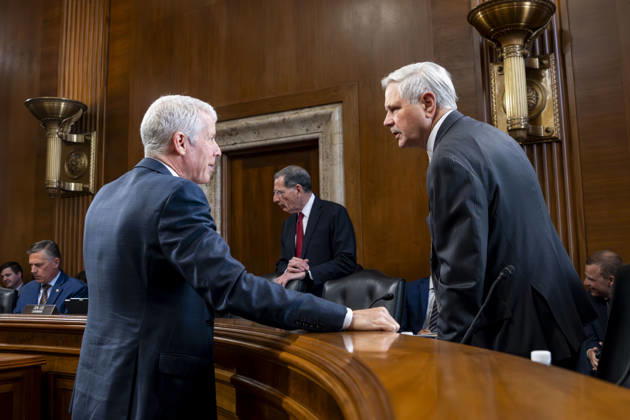 Sen. John Hoeven, R-ND, speaks with Secretary of Energy Chris Wright before a Senate Energy and Natural Resources Committee hearing on the Department of Energy s budget request for fiscal year 2027 in the Dirksen Senate Office Building near the U.S. Capitol in Washington, DC on Tuesday, April 21, 2026. Wright has warned that gas prices may not drop below $3 until next year, which the Trump Administration claims is totally wrong.  WAP20260421301 BONNIExCASH
