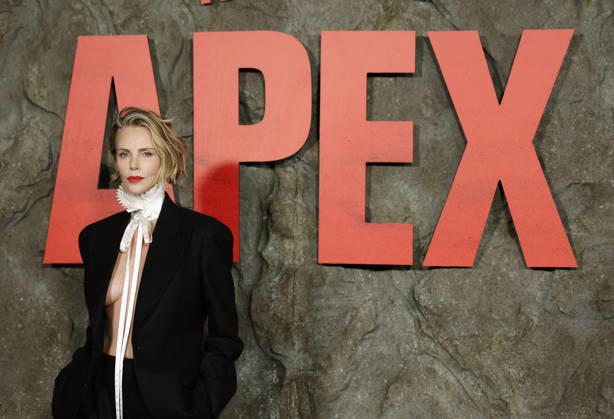 Charlize Theron arrives on the red carpet at Netflix s APEX New York Premiere at The Paris Theater on Wednesday, April 22, 2026 in New York City.  NYP20260422215 JohnxAngelillo
