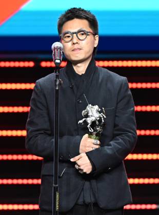 Russia Moscow International Film Festival 9150209 23.04.2026 Chinese film director Zheng Xusong receives the Silver St. George for the Best Documentary for his film The Long Way Home during the closing ceremony of the 48th Moscow International Film Festival (MIFF) in Moscow, Russia. Ekaterina Chesnokova Sputnik Moscow Russia  Copyright: xEkaterinaxChesnokovax