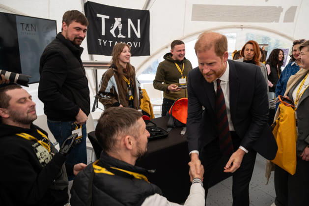 Prince Harry (C), The Duke of Sussex, visits the exhibition area of ??the TYTANOVI Rehabilitation Centre in the mobile town during the Invictus Games Ukraine Forum, dedicated to the 10th anniversary of the Invictus Games movement in Ukraine, at the National Museum of the History of Ukraine in WWII Memorial Complex, Kyiv, Ukraine, April 24, 2026. Ukraine has participated in the Invictus Games since 2017, showing strong results and steady team growth. The Ukrainian team competes in athletics, archery, rowing, and swimming, earning numerous medals and prize placements. (Photo by Danylo Antoniuk Ukrinform) Invictus Games Ukraine Forum in Kyiv Copyright: xDanyloxAntoniukx