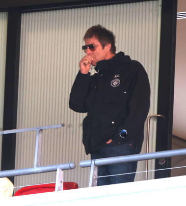 Liam Gallagher with what looks like a vape in his hand at the Emirates FA Cup Semi-Final match Manchester City v Southampton, at Wembley Stadium, London, UK on 25th April, 2026. 