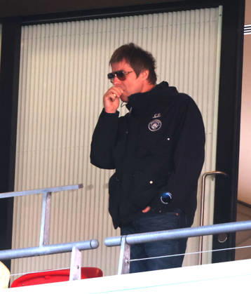 Liam Gallagher with what looks like a vape in his hand at the Emirates FA Cup Semi-Final match Manchester City v Southampton, at Wembley Stadium, London, UK on 25th April, 2026. 