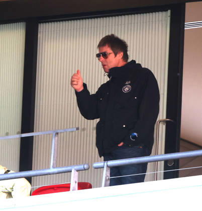 Liam Gallagher with what looks like a vape in his hand at the Emirates FA Cup Semi-Final match Manchester City v Southampton, at Wembley Stadium, London, UK on 25th April, 2026. 
