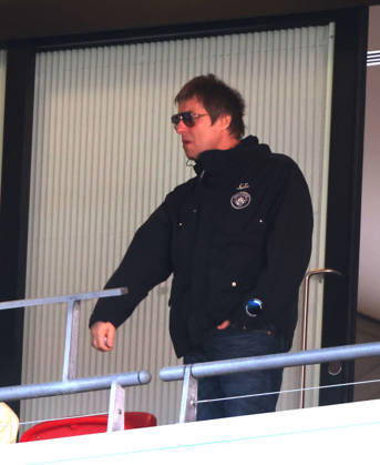 Liam Gallagher with what looks like a vape in his hand at the Emirates FA Cup Semi-Final match Manchester City v Southampton, at Wembley Stadium, London, UK on 25th April, 2026. 