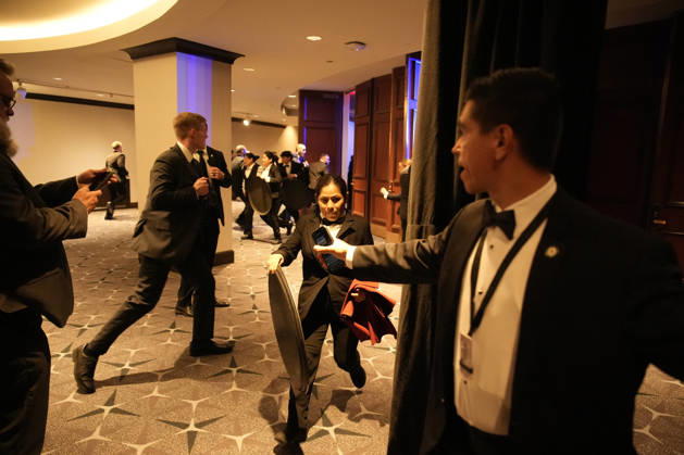 Employees, Secret Service and members of staff flee in the Washington Hilton after shots were heard during the White House Correspondents Dinner in Washington, DC, on April 25, 2026. Shots were fired as President Donald Trump attended a press dinner for the first time as President.  WASP20260425121 YurixGripas