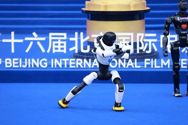 BEIJING, CHINA - APRIL 25: A humanoid robot performs at the closing ceremony of the 16th Beijing International Film Festival on April 25, 2026 in Beijing, China.  Copyright: xVCGx 111637235612