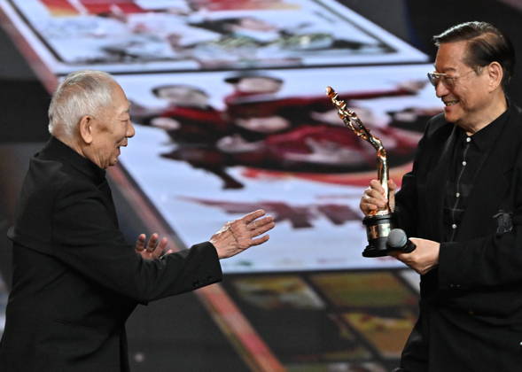 BEIJING, CHINA - APRIL 25: Martial arts choreographer and film director Yuen Woo-ping (L) receives the Lifetime Achievement Award at the closing ceremony of the 16th Beijing International Film Festival on April 25, 2026 in Beijing, China.  Copyright: xVCGx 111637296117