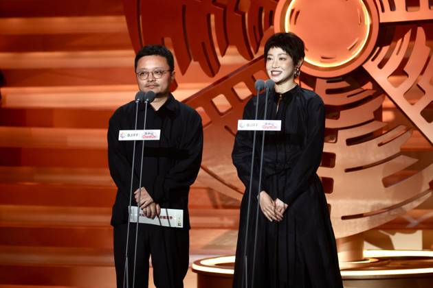 BEIJING, CHINA - APRIL 25: Director Bi Gan and actress Tan Zhuo stand on the stage at the closing ceremony of the 16th Beijing International Film Festival on April 25, 2026 in Beijing, China.  Copyright: xChinaxNewsxServicex 111637303824
