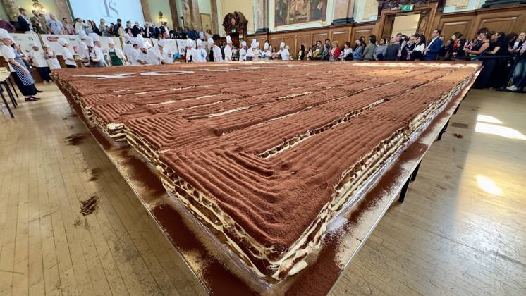 World s longest tiramisu record broken in London LONDON, UNITED KINGDOM - APRIL 26: A record-breaking tiramisu, measuring 440.58 meters, is displayed at Chelsea Old Town Hall in London, United Kingdom on April 26, 2026. Led by Italian entrepreneur Mirko Ricci and the London branch of the Federation of Italian Chefs, dozens of volunteers collaborated over two days to surpass the previous 273.5-meter record set in Milan in 2019. Guinness World Records official adjudicator Lorenzo Veltri verified the measurement on-site during the event, which was supported by the Italian Embassy and the Italian Cultural Institute. All proceeds from the organization were donated to the Esharelife Foundation to support efforts in combating poverty. Muhammed Yay  Copyright: x2026xAnadoluxMuhammedxYaylalix