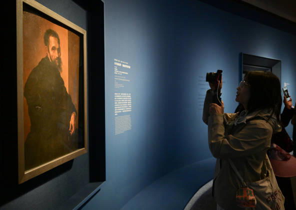 (260427) -- BEIJING, April 27, 2026 -- A visitor takes photos of an art work during an exhibition in Beijing, capital of China, April 27, 2026. An art exhibition Homage to the Virtuosos: From Leonardo da Vinci to Caravaggio -- Masterpieces of the Italian Renaissance opens to the public here on Monday. This exhibition displays 36 masterpieces by more than 20 renowned Italian artists from the 15th to the 17th centuries, including Botticelli, da Vinci, Michelangelo, and Raphael. Most of the works are on display in China for the first time. ) CHINA-BEIJING-ITALIAN RENAISSANCE-EXHIBITION (CN) LixHe 