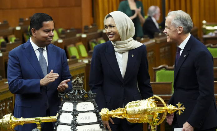 April 27, 2026, Ottawa, On, CAN: Prime Minister Mark Carney, right, and Minister of Public Safety Gary Anandasangaree, left, introduce new member of Parliament Doly Begumon to the House of Commons on Parliament Hill in Ottawa on Monday, April 27, 2026. Ottawa CAN - ZUMAc35_ 20260427_zaf_c35_037 Copyright: xSeanxKilpatrickx