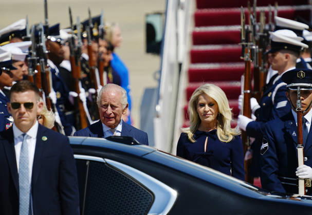 Britain s King Charles III and Queen Camilla (partially hidden) are joined by U.S. Chief of Protocol Monica Crowley (R) during a flight line arrival ceremony at Joint Base Andrews in Suitland, Maryland on Monday, April 27, 2026. The king is on a four-day state visit to the U.S. and will stop in New York and Washington, where he will meet with President Trump and deliver an address to Congress.  WAP20260427804 BONNIExCASH