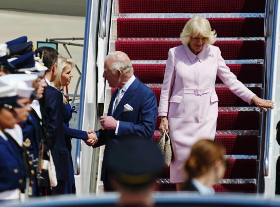Britain s King Charles III shakes hands with U.S. Chief of Protocol Monica Crowley as he and Queen Camilla walk off their plane during a flight line arrival ceremony at Joint Base Andrews in Suitland, Maryland on Monday, April 27, 2026. The king is on a four-day state visit to the U.S. and will stop in New York and Washington, where he will meet with President Trump and deliver an address to Congress.  WAP20260427813 BONNIExCASH
