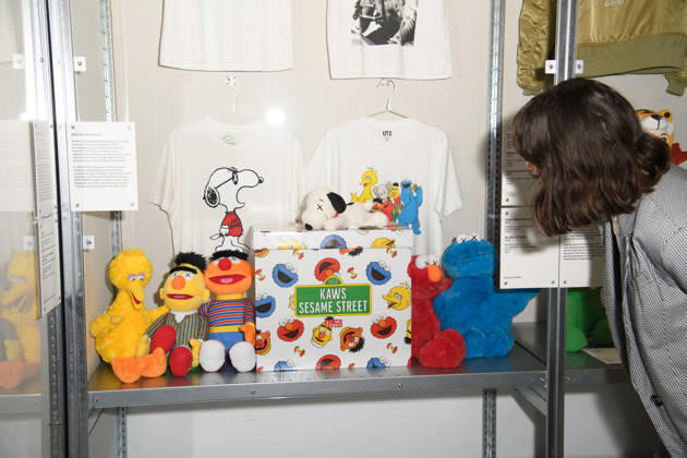 NIGO: From Japan with Love Press Preview at Design Museum, London, UK - A staff member poses with Sesame Street, Snoopy collection as part of Nigo for Uniqlo UT Line x KAWS at a photocall for The Design Museum s NIGO: From Japan with Love Exhibition at The Design Museum in London, England, UK on Tuesday 28 April 2026 which runs from 1st May 2026 - 4th October 2026., Credit:Justin Ng Avalon UK, England, London, Design Museum  Copyright: xJustinxNgx xAvalonx 1094977872