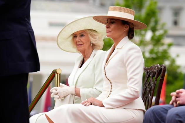 Queen Camila and First lady Melania Trump sit on the podium during an official welcoming ceremony for Britain s King Charles III at the White House in Washington DC on Tuesday, April 28, 2026. The king is on a four-day state visit to the U.S. and will stop in New York and Washington, where he will meet with U.S. officials and deliver an address to Congress.  WAX20260428850 YURIxGRIPAS
