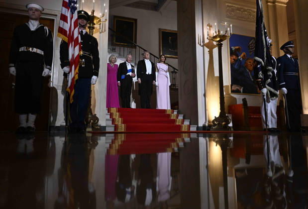 President Donald Trump and first lady Melania Trump pose for a photo with Britain s King Charles III and Queen Camilla before a state dinner at the White House on Tuesday, April 28, 2026 in Washington, DC. Charles spoke to a joint session of Congress earlier in the day, and attended several events with U.S. President Donald Trump.  WAX20260428214 CraigxHudson