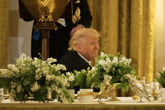President Donald Trump smiles as Great Britain s King Charles gives remarks during a state dinner with President Donald Trump and First Lady Melania Trump at the White House on Tuesday, April 28, 2026 in Washington, D.C. Charles spoke to a joint session of Congress earlier in the day, and attended several events with U.S. President Donald Trump.  WAX20260428231 CraigxHudson