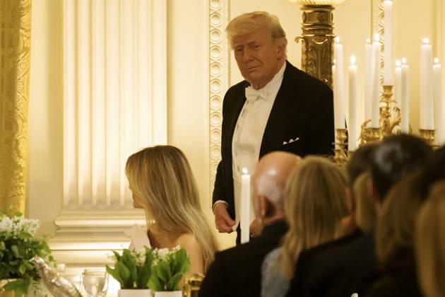 President Donald Trump looks towards a table as guests such as Amazon Founder Jeff Bezos listen to Great Britain s King Charles giving remarks during a state dinner at the White House on Tuesday, April 28, 2026 in Washington, D.C. Charles spoke to a joint session of Congress earlier in the day, and attended several events with U.S. President Donald Trump.  WAX20260428229 CraigxHudson