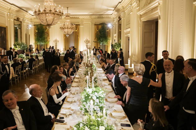 Guests, including Amazon Founder Jeff Bezos, right, mingle as President Donald Trump hosts a state dinner with Great Britain s King Charles and Queen Camilla at the White House on Tuesday, April 28, 2026 in Washington, D.C. Charles spoke to a joint session of Congress earlier in the day, and attended several events with U.S. President Donald Trump.  WAX20260428237 CraigxHudson