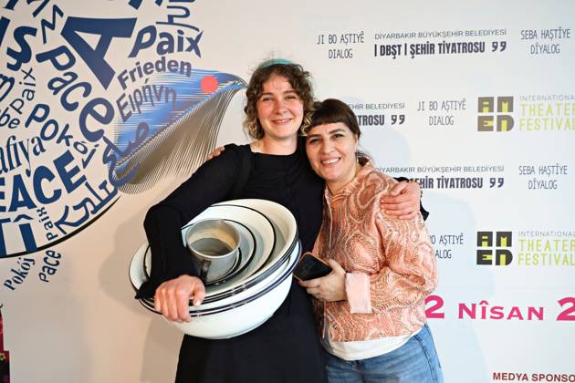 April 29, 2026, Diyarbakir, Turkey: The actresses Julia Milir (L) and Berfin Emektar (R) seen posing with the pots and plates used in the play Brave Women . The 11th Amed International Theater Festival, organized by the Diyarbakir Metropolitan Municipality and the Amed City Theater from April 22 to May 2, featured theater companies from 19 countries and 22 performances. Diyarbakir Turkey  - ZUMAs197 20260429_aab_s197_037 Copyright: xMehmetxMasumxSuerx