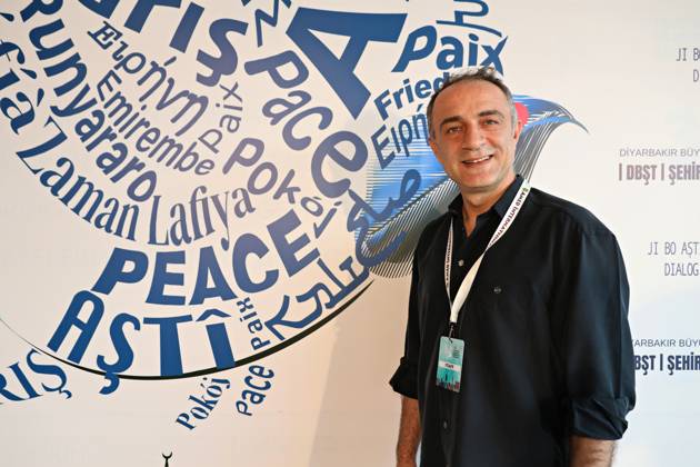 April 29, 2026, Diyarbakir, Turkey: Famous Kurdish theater actor Yavuz Akkuzu seen in front of the festival billboard. The 11th Amed International Theater Festival, organized by the Diyarbakir Metropolitan Municipality and the Amed City Theater from April 22 to May 2, featured theater companies from 19 countries and 22 performances. Diyarbakir Turkey  - ZUMAs197 20260429_aab_s197_034 Copyright: xMehmetxMasumxSuerx