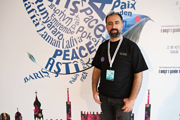 April 29, 2026, Diyarbakir, Turkey: Kurdish theater actor Sena Ozbey seen in front of the festival billboard. The 11th Amed International Theater Festival, organized by the Diyarbakir Metropolitan Municipality and the Amed City Theater from April 22 to May 2, featured theater companies from 19 countries and 22 performances. Diyarbakir Turkey  - ZUMAs197 20260429_aab_s197_032 Copyright: xMehmetxMasumxSuerx